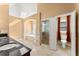 Spacious bathroom with dual sinks, a tub, and a separate glass enclosed shower at 300 Morganshire Pl, Atlanta, GA 30350