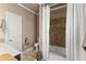 Cozy bathroom featuring a shower with a tiled wall and neutral tones at 300 Morganshire Pl, Atlanta, GA 30350