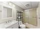 Bathroom with white cabinets, sink, shower with sliding glass doors, and modern fixtures at 300 Morganshire Pl, Atlanta, GA 30350