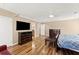Comfortable bedroom boasting hardwood floors and a ceiling fan with convenient access to a bathroom at 300 Morganshire Pl, Atlanta, GA 30350