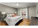 Inviting bedroom featuring a comfortable bed and natural light from the window at 300 Morganshire Pl, Atlanta, GA 30350
