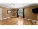 Cozy bedroom with hardwood floors, neutral paint, ample natural light, and flush mount ceiling lights at 300 Morganshire Pl, Atlanta, GA 30350