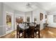 Dining area with a dark wood table, natural light, and views to the backyard at 300 Morganshire Pl, Atlanta, GA 30350