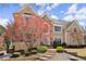 Beautiful two-story home with a stone facade, well-manicured lawn, mature landscaping, and grand curb appeal at 300 Morganshire Pl, Atlanta, GA 30350