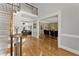 Open foyer featuring hardwood floors, staircase, and a view into the living and dining rooms at 300 Morganshire Pl, Atlanta, GA 30350