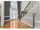 Elegant foyer featuring hardwood floors, decorative front door, and an ornate staircase at 300 Morganshire Pl, Atlanta, GA 30350