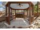 Wooden gazebo featuring benches and a porch swing, surrounded by landscaping at 300 Morganshire Pl, Atlanta, GA 30350