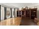 Spacious home office with hardwood floors, built-in shelving, and large windows with natural light at 300 Morganshire Pl, Atlanta, GA 30350