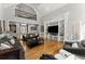 Bright living room with hardwood floors, high ceilings, built-ins, and large windows at 300 Morganshire Pl, Atlanta, GA 30350