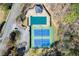 Aerial view of community tennis and pool area showing well-maintained courts with bright blue surfaces at 300 Morganshire Pl, Atlanta, GA 30350