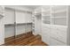 Walk-in closet features custom shelving, drawers, and ample storage space at 300 Morganshire Pl, Atlanta, GA 30350