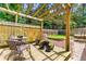Outdoor deck area with a wooden pergola and fenced-in yard at 4131 N Gloucester Pl, Atlanta, GA 30341