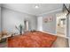 Bright bedroom featuring wood floors, a large rug and gray walls with white trim at 4131 N Gloucester Pl, Atlanta, GA 30341