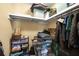 Walk-in closet with shelves, hanging rods, and assorted storage containers at 4131 N Gloucester Pl, Atlanta, GA 30341