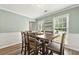 Dining room with natural lighting and rustic wooden furniture at 4131 N Gloucester Pl, Atlanta, GA 30341