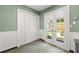 Bright kitchen area with white doors to backyard patio and closet for storage at 4131 N Gloucester Pl, Atlanta, GA 30341