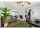 Comfortable living room featuring a painted fireplace, adjacent to a home office, and modern decor at 4131 N Gloucester Pl, Atlanta, GA 30341