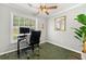 Bright home office featuring a desk, a modern ceiling fan, and natural light from the window at 4131 N Gloucester Pl, Atlanta, GA 30341