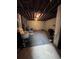 Unfinished basement with exposed beams and stone fireplace at 4925 Happy Hollow Rd, Dunwoody, GA 30360