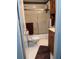 Functional bathroom with a shower-tub combo, tiled floor, and vanity, providing essential amenities at 4925 Happy Hollow Rd, Dunwoody, GA 30360