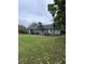 Lovely ranch home with attached garage, featuring a well-maintained lawn and mature trees at 4925 Happy Hollow Rd, Dunwoody, GA 30360