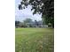Beautiful ranch home with garage, a well-maintained lawn, and mature trees in yard at 4925 Happy Hollow Rd, Dunwoody, GA 30360