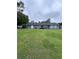 Relax on the back deck with a sprawling, grassy lawn perfect for outdoor fun and relaxation at 4925 Happy Hollow Rd, Dunwoody, GA 30360