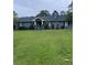 Inviting ranch home with manicured lawn, attractive landscaping, and classic architectural details at 4925 Happy Hollow Rd, Dunwoody, GA 30360
