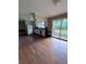 Eat-in kitchen that features white appliances, light cabinets, hardwood floors and access to deck at 4925 Happy Hollow Rd, Dunwoody, GA 30360