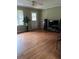 Bright living room with hardwood floors, large windows and ample space at 4925 Happy Hollow Rd, Dunwoody, GA 30360
