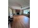Bright living room features hardwood floors, a fireplace, ceiling fan and large window at 4925 Happy Hollow Rd, Dunwoody, GA 30360