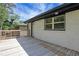 Exterior shot of a back deck with white brick wall and a view of the yard at 644 Church Nw St, Atlanta, GA 30318