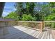Large wooden back deck overlooking mature trees, providing space for outdoor relaxation and entertaining at 644 Church Nw St, Atlanta, GA 30318