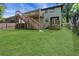 Backyard with lush green lawn, wooden decks, and staircase, offers a serene outdoor space at 644 Church Nw St, Atlanta, GA 30318