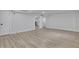 Finished basement space featuring light wood flooring and access to the finished bar area at 644 Church Nw St, Atlanta, GA 30318