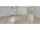Finished basement with light wood flooring and french doors leading to the outside deck at 644 Church Nw St, Atlanta, GA 30318