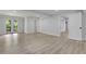 Finished basement with light wood flooring and glass doors leading to the outside deck at 644 Church Nw St, Atlanta, GA 30318