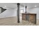 Finished basement with a stylish bar area, recessed lighting, and durable floors at 644 Church Nw St, Atlanta, GA 30318