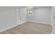 Finished basement with light wood flooring, window for natural light, and a closet for storage at 644 Church Nw St, Atlanta, GA 30318