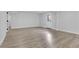 Finished basement featuring light wood flooring, neutral paint, and outside access at 644 Church Nw St, Atlanta, GA 30318