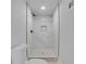 Modern bathroom with a glass shower stall and mosaic tile at 644 Church Nw St, Atlanta, GA 30318