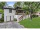 Exterior of a home with a well-maintained yard, garage, and front porch at 644 Church Nw St, Atlanta, GA 30318