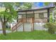 Charming home featuring a brick facade, inviting porch, and well-maintained lawn at 644 Church Nw St, Atlanta, GA 30318