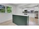 Open concept kitchen with an island, white cabinets, and stainless steel appliances at 644 Church Nw St, Atlanta, GA 30318