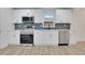 Contemporary kitchen features white cabinets, stainless steel appliances, and sleek countertops at 644 Church Nw St, Atlanta, GA 30318