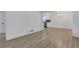 Spacious living room featuring stylish light wood floors, neutral paint, and an open floor plan at 644 Church Nw St, Atlanta, GA 30318