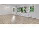Bright living room featuring hardwood floors, white walls, and abundant natural light at 644 Church Nw St, Atlanta, GA 30318