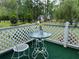 Cozy balcony with a small table and chair, perfect for enjoying the tranquil outdoor scenery at 126 Brittany Dr, Canton, GA 30115