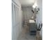 Well lit bathroom with closet, marble floors, neutral colors, and updated sink at 126 Brittany Dr, Canton, GA 30115