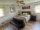 Cozy bedroom with a comfortable bed, soft lighting, and serene decor at 126 Brittany Dr, Canton, GA 30115